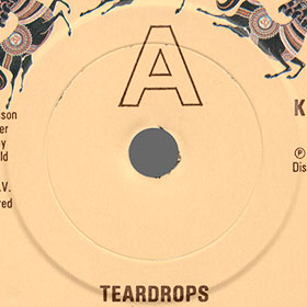 George Harrison - Teardrops / Save The World (Dark Horse K 17837 / DHS 0511) –  different stamps of press mould around central hole of records