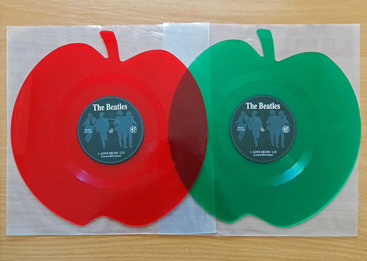 The Beatles Green and red colored apple shaped 12 inch singles Love Me Do / P.S. I Love You from Mischief Music
